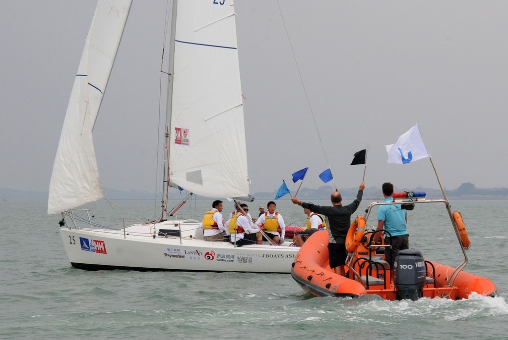 Not the flags you want to see - China Club Challenge Match 2011 © Alistair Skinner